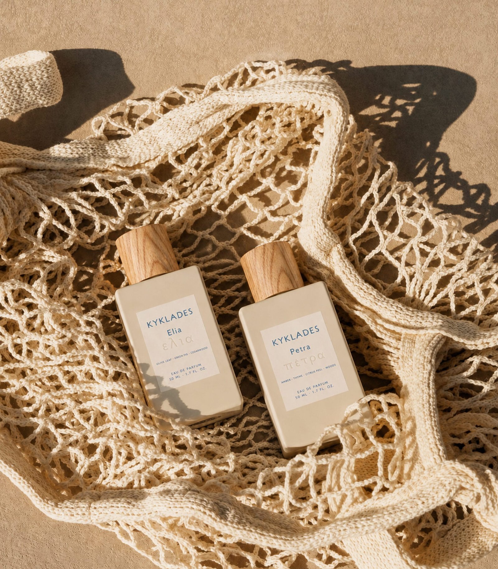 KYKLADES Petra and Elia perfumes in a white net bag